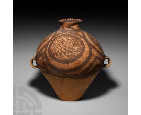 3rd millennium B.C. A ceramic jar with piriform body, bulbous neck, everted rim and two integral loop handles below the shoul
