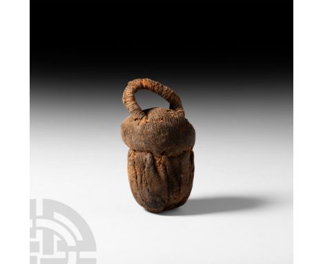 7th-4th century B.C. A mummified animal or insect (most probably a beetle) contained within a large woven fabric acorn-shaped