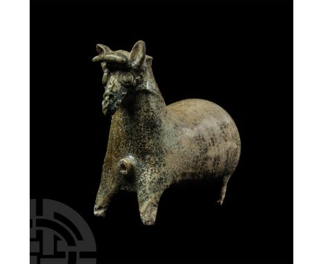 1st-2nd century A.D. A glazed ceramic rhyton formed as a stylised standing horse with stout forequarters and an exaggerated, 