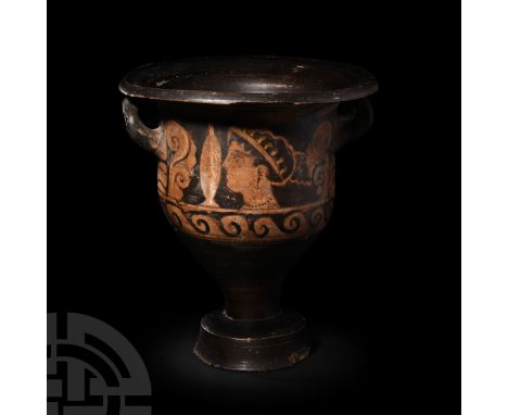 Late 4th century B.C. A red-figure bell krater with an inverted bell-shaped body, decorated on both sides with a female face 