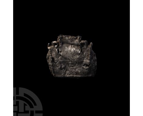 13th-15th century A.D. A tin ampulla of 'church' or 'chasse' type, formed as a church building, with a rectangular body, slop