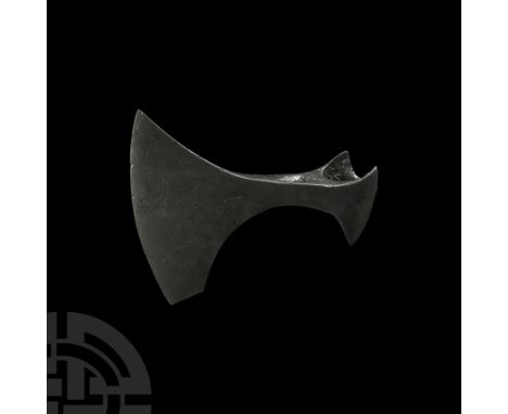 10th-11th century A.D. An iron bearded axehead with broad flaring triangular-section blade and chin to the lower edge, round 
