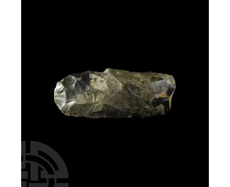 Mesolithic, c.8th-4th millennium B.P. A complete knapped flint adze, broadly rectangular in plan comprising parallel sides, r