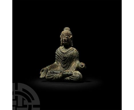 5th-10th century A.D. A statuette modelled in the round as Buddha seated in padmasana, hair covering ushnisha, stylised facia