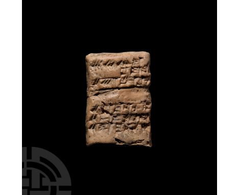3rd-2nd millennium B.C. A ceramic cuneiform tablet with a slightly curved profile, cuneiform text to both faces.  81 grams, 6
