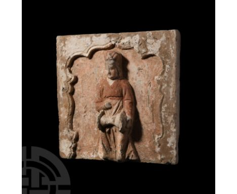 Song Dynasty, 960-1127 A.D. A terracotta tile with a facing high-relief figure of a female in floor-length robe with sash to 