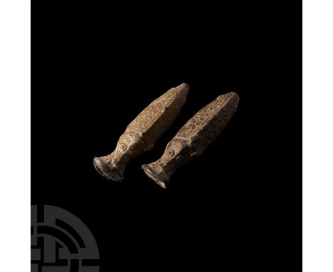 3rd-2nd millennium B.C. A pair of amuletic lead vessels formed as stylised fish with detailing to scales and heads, exaggerat