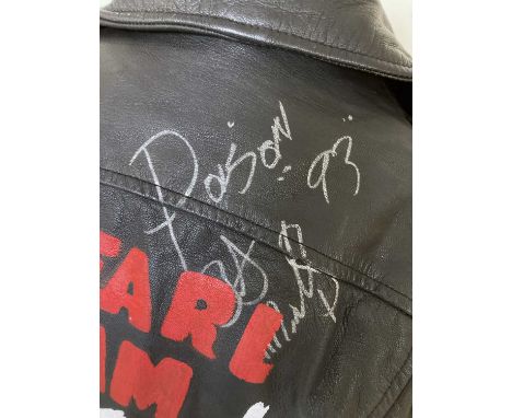 A leather jacket (size 48) with painted Pearl Jam design to reverse and a signature by Poison Ivy of The Cramps dated 1993.