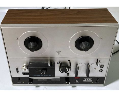 An Akai 4000D  reel to reel player in original box with some power cables and instruction manual. A pair of Aiwa SX780A speak