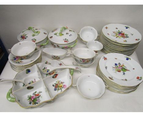 A Herend porcelain dinner service decorated with fruit, vegetables and nuts with blue back stamps, comprising twelve dinner p
