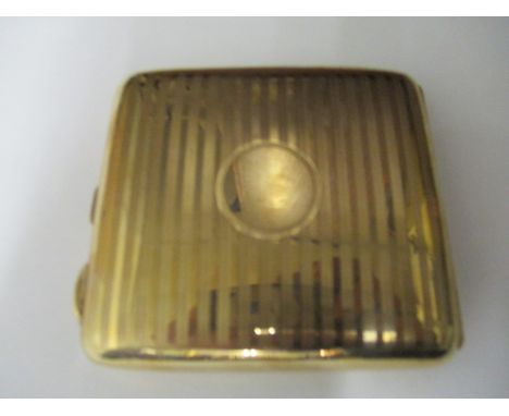 A George V 9ct gold cigarette case by Charles S Green and Co Ltd Birmingham 1919, of curved, cushion form with engine turned 