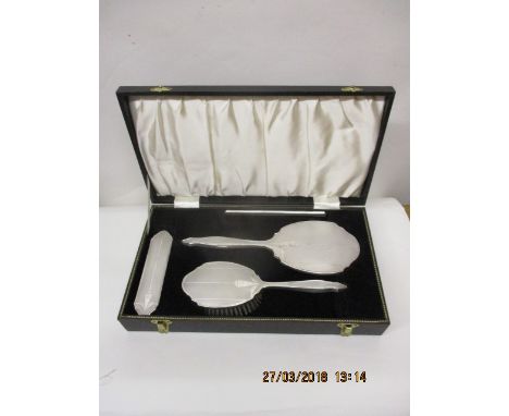 A mid 20th century four piece silver backed dressing table set by Broadway & Co, Birmingham 1960, with engine turned decorati