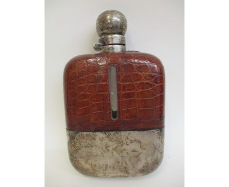 An early 20th century large leather clad, glass and silver hip flask by James Ramsay, Sheffield 1921, with a hinged screw cap