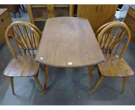 An Ercol drop leaf table and four chairs