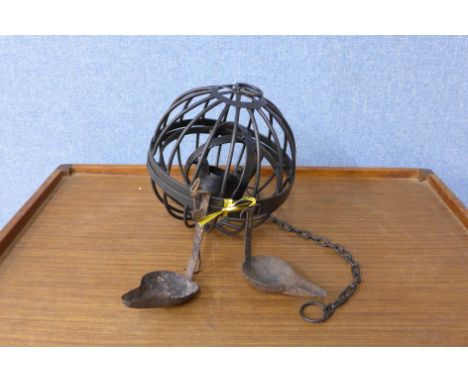A pair of 19th Century whale oil lamps and a reproduction gymbal whale oil lamp cage 
