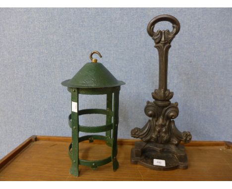 A Victorian cast iron door porter, stamped 161 and a wrought iron lantern frame