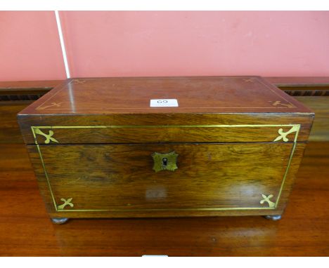 A George IV rosewood and brass inlaid tea caddy