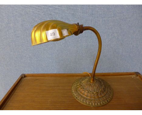 A brass shell angle poise lamp