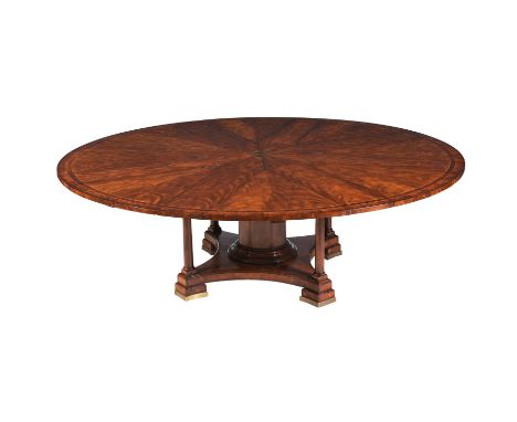 A MAHOGANY EXTENDING DINING TABLE AFTER THE JUPE MODEL  RECENTLY MANUFACTURED BY BRIGHTS OF NETTLEBED With eight additional l