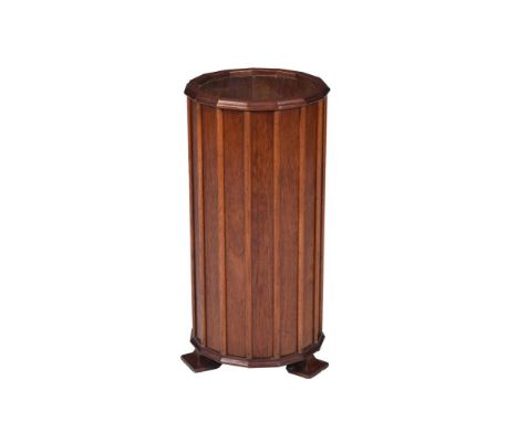 AN ART DECO WALNUT STICK STAND  CIRCA 1930 Of facetted cylindrical form on shaped feet 67cm high, 33cm wide overall 