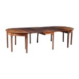 A GEORGE III MAHOGANY DINING TABLE