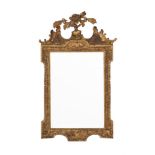 A GILTWOOD WALL MIRROR IN GEORGE III STYLE