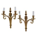 A PAIR OF GILT BRONZE TWIN LIGHT WALL APPLIQUES IN LOUIS XVI TASTE