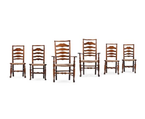 A HARLEQUIN SET OF SIX ASH LADDER BACK DINING CHAIRS  To include a pair of armchairs, each with a rush seat Provenance:  Hunt