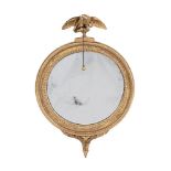 A GILTWOOD CONVEX WALL MIRROR