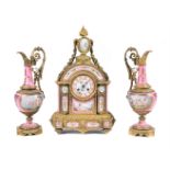 A FRENCH GILT METAL MOUNTED AND PINK PORCELAIN SEVRES STYLE CLOCK GARNITURE