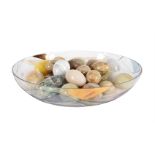 A COLLECTION OF APPROXIMATELY TWENTY SEVEN CARVED STONE MODELS OF EGGS