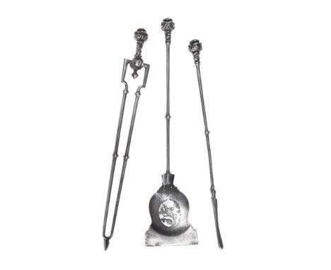 A SET OF THREE POLISHED STEEL FIRE TOOLS  FIRST QUARTER 19TH CENTURY Each with a rose-bud pattern finial The poker 70cm long 