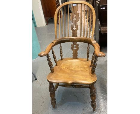 Ash and elm stick and splat backed kitchen fireside elbow chair with moulded saddle seat on baluster turned legs.  (B.P. 21% 