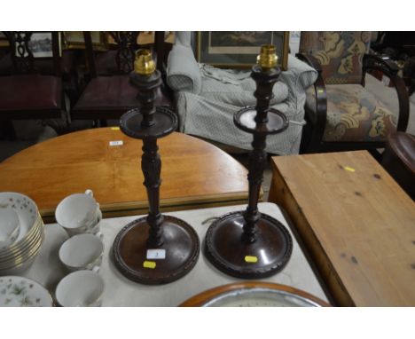 A pair of carved mahogany table lamp bases 