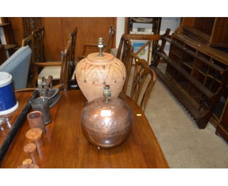 An Eastern copper table lamp base; and a pottery table lamp base