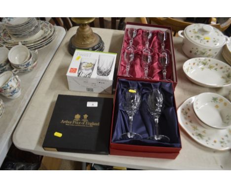 A set of six Royal Albert drinking glasses in original box; a pair of Doulton crystal wine glasses in original box; a set of 