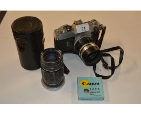 A Canon FX camera with lens etc.