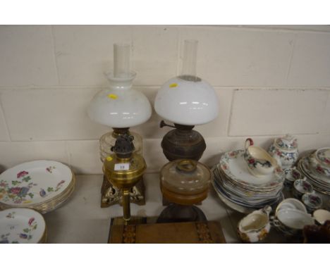 Four various late Victorian and early 20th Century oil lamp bases 