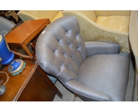 A modern button back armchair 