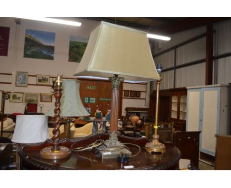 A barley twist table lamp base; together with a Corinthian column table lamp base; and one other 