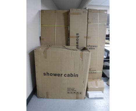 A boxed new shower cabinet, ceramic hand basin and taps 