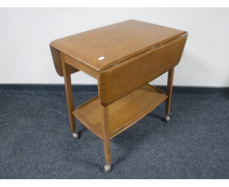 An Ercol drop leaf tea trolley 
