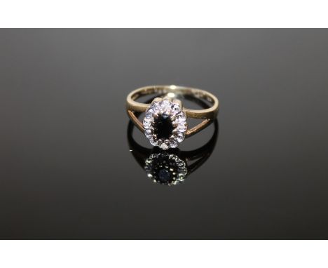 A 9ct gold sapphire and diamond ring, size M/N