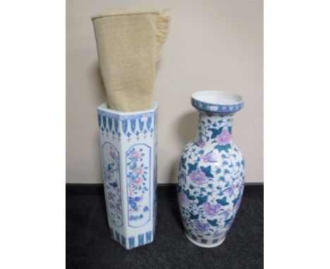 An oriental style porcelain stick stand and vase together with a fringed rug