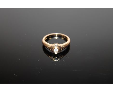 An 18ct gold ring set with a .15 solitaire diamond, 4.3g