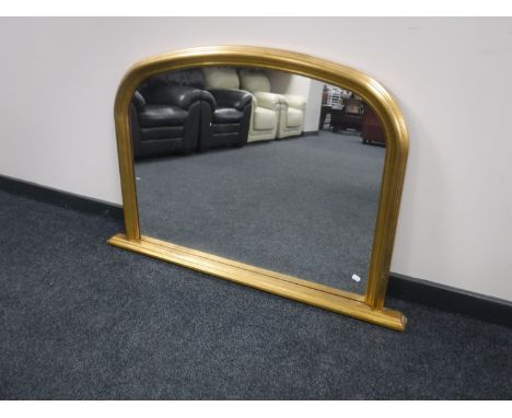 A gilt framed over mantel mirror 