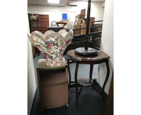 An Edwardian occasional table, standard lamp with shade and a loom bedside stand 