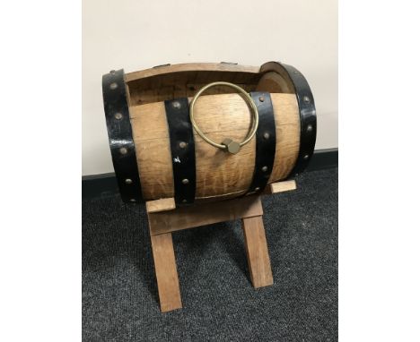 An oak coopered barrel plant trough on stand 