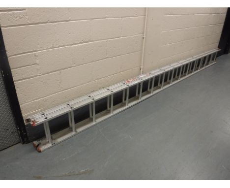 A double aluminium extension ladder with rest 