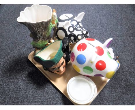 A tray containing a large Royal Doulton character jug Dick Turpin D6828, together with three contemporary money boxes, fauna 
